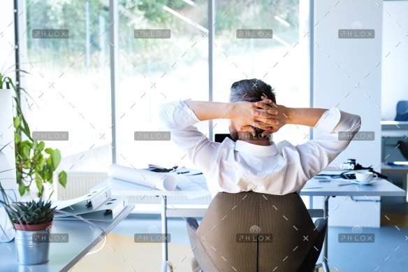 demo-attachment-31-Businessman-at-the-desk-in-his-office-resting.